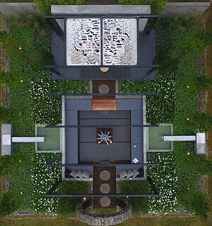 Aerial view of geometric garden with circular moon gate, fire sculpture and symmetrical plantings at Nagasaki Japan