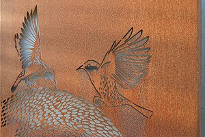 Custom corten steel bird artwork with detailed wing patterns installed in modern native garden design, Buninyong Victoria