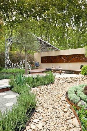 Modern curved pavilion with decorative screens and native plantings in award-winning Wave Garden, Carlton Victoria