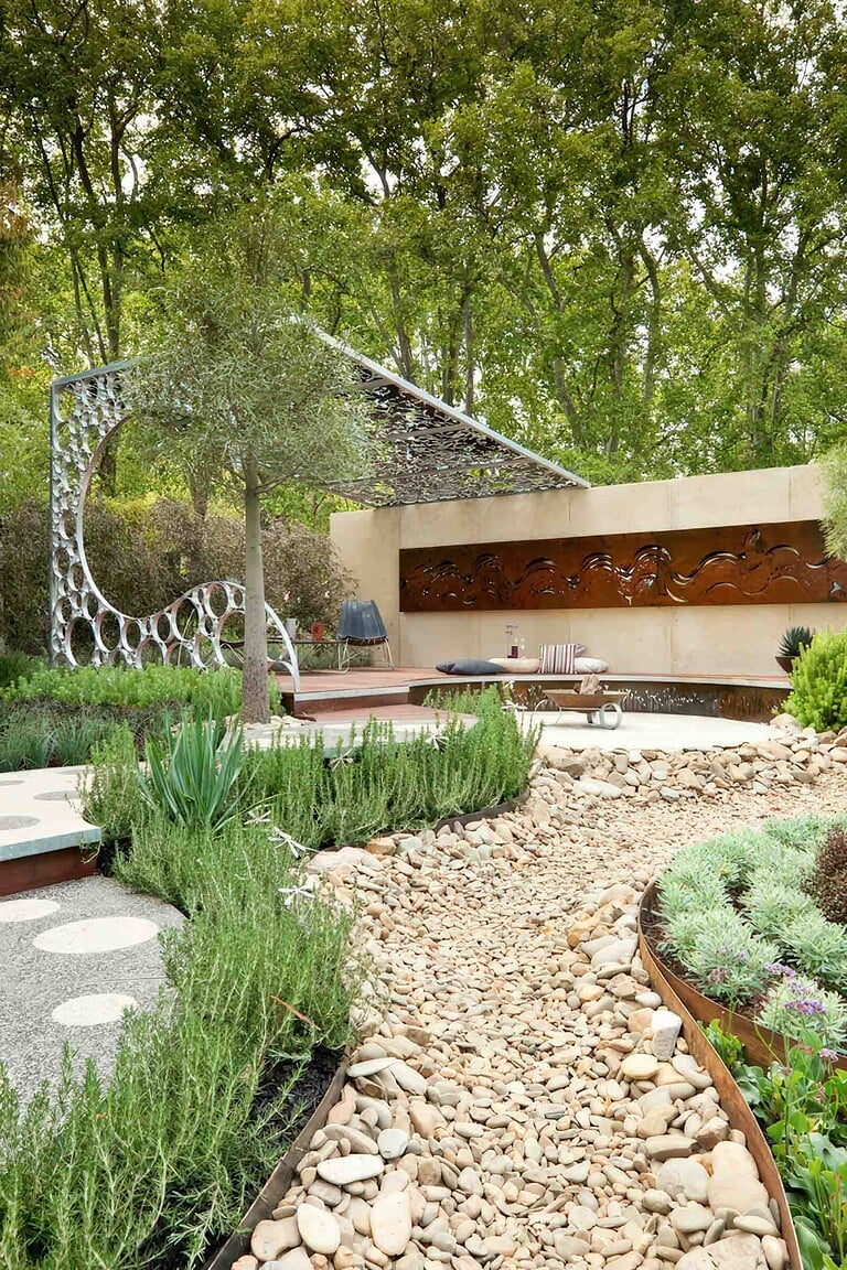 Modern curved pavilion with decorative screens and native plantings in award-winning Wave Garden, Carlton Victoria