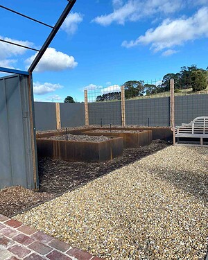 Timber raised garden beds under construction with gravel base in Gisborne country garden project